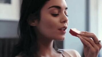 Vanessa Hudgens enjoys putting something in her mouth. Just look how she wraps her lips around it...
