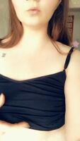 elt like showing what’s hiding under this tight black tank top 💋