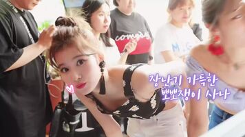 Sana leaning over