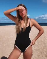 Black one piece with a little white trim